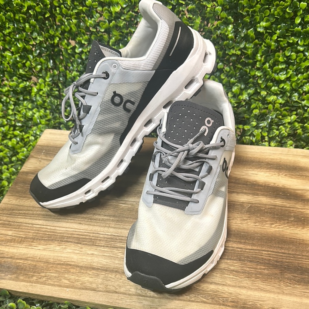 On Running Gray and White Athletic Shoes with Modern Design